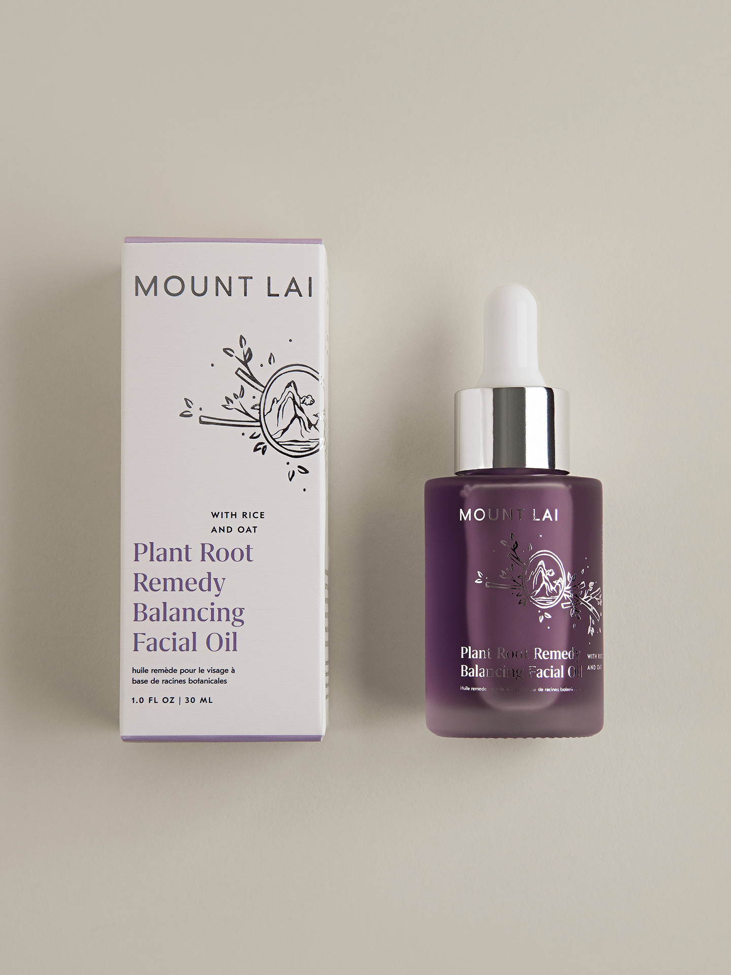 Nourishing Plant Root Remedy Balancing Facial Oil next to beautiful packaging