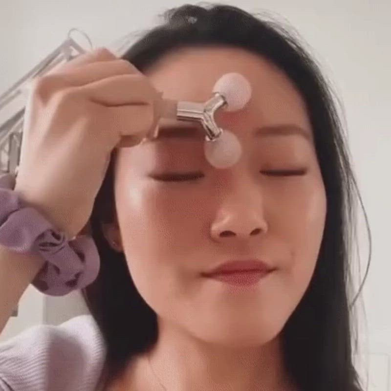 Load video: The Rose Quartz Tension Melting Massager for Face &amp; Neck