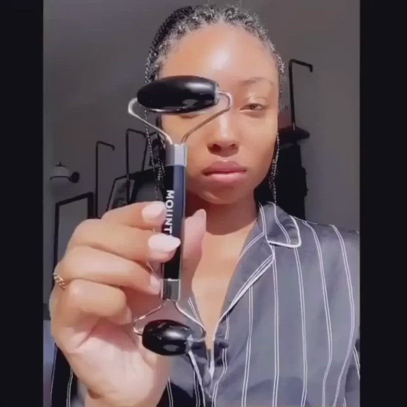 Load video: The Warming Black Obsidian Facial Roller